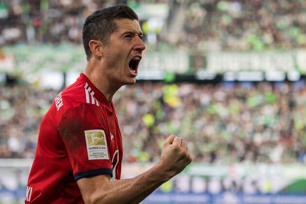 Bayern Munich's Polish forward Robert Lewandowski celebrates after scoring during the German First division Bundesliga football match between VfL Wolfsburg and Bayern Munich, on October 20, 2018 in Wolfsburg. (Photo by John MACDOUGALL / AFP) / DFL REGULATIONS PROHIBIT ANY USE OF PHOTOGRAPHS AS IMAGE SEQUENCES AND/OR QUASI-VIDEO        (Photo credit should read JOHN MACDOUGALL/AFP/Getty Images)