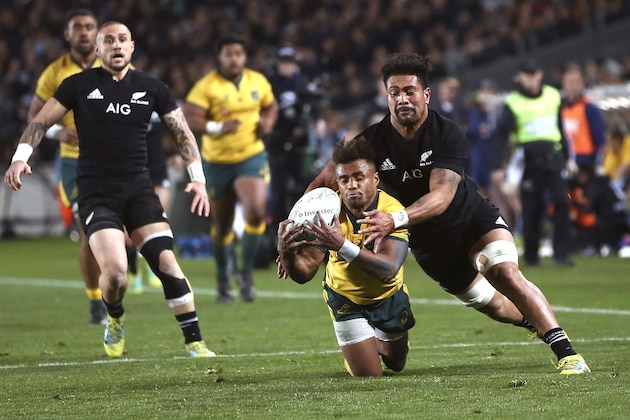 New Zealand's Ardie Savea tackles Australia's Will Genia in the Bledisloe Cup rugby test match at Eden Park in Auckland, New Zealand, Saturday Aug. 25, 2018. (AP Photo/David Rowland)