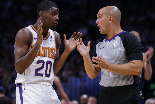 Phoenix Suns forward Josh Jackson (20) argues a call with referee Jacyn Goble during the third quarter of an NBA basketball game against the Denver Nuggets, Saturday, Oct. 20, 2018, in Denver. (AP Photo/Jack Dempsey)