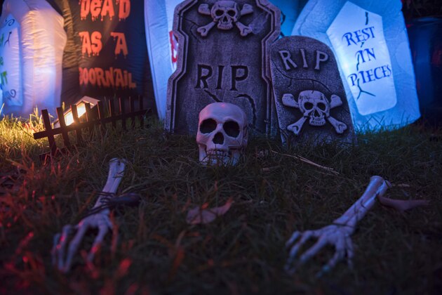 Halloween decorations are seen in a garden at sunset in Washington DC on October 20, 2018. - Spending in the US this year is expected to reach $9 billion as more than 175 million Americans are expected to partake in Halloween festivities on October 31st. (Photo by Eric BARADAT / AFP)        (Photo credit should read ERIC BARADAT/AFP/Getty Images)