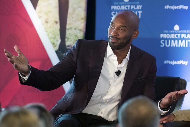FILE - In this Tuesday, Oct. 16, 2018 file photo, former NBA basketball all-star Kobe Bryant gestures as he moderates a panel about youth sports during the Aspen Institute's Project Play Summit in Washington. Kobe Bryant has been dropped from the jury of an animated film festival after calls for the former NBA star’s ouster over a 2003 rape allegation. The CEO of the organization behind the Animation Is Film Festival said in a statement Wednesday, Oct. 17, 2018 that the festival’s stakeholders decided to drop Bryant to keep its focus on films.(AP Photo/Alex Brandon, File)