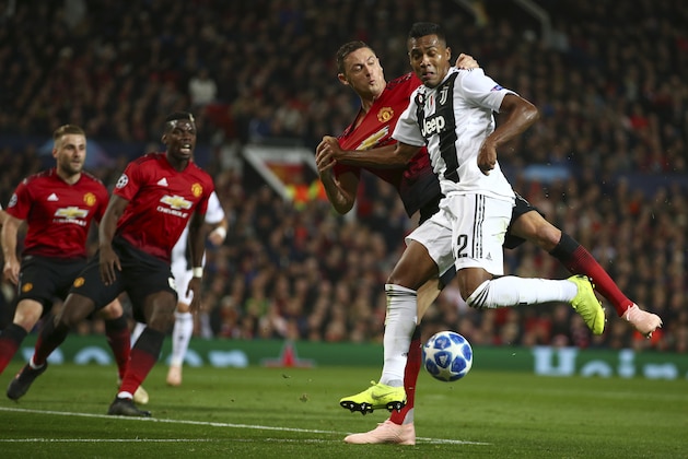 ManU midfielder Nemanja Matic fights for the ball with Juventus defender Alex Sandro, right, during the Champions League group H soccer match between Manchester United and Juventus at Old Trafford, Manchester, England, Tuesday, Oct. 23, 2018. (AP Photo/Dave Thompson) ManU midfielder Nemanja Matic fights for the ball with Juventus defender Alex Sandro, right, during the Champions League group H soccer match between Manchester United and Juventus at Old Trafford, Manchester, England, Tuesday, Oct. 23, 2018. (AP Photo/Dave Thompson)