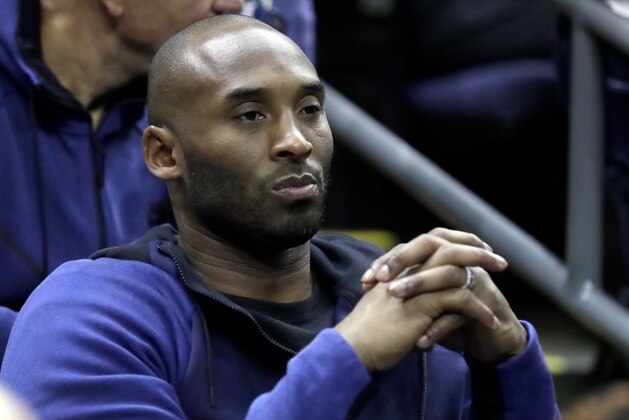Former Los Angeles Lakers' Kobe Bryant watches from the stands during the first half in the semifinals of the women's NCAA Final Four college basketball tournament game between Connecticut and Notre Dame, Friday, March 30, 2018, in Columbus, Ohio. (AP Photo/Ron Schwane)