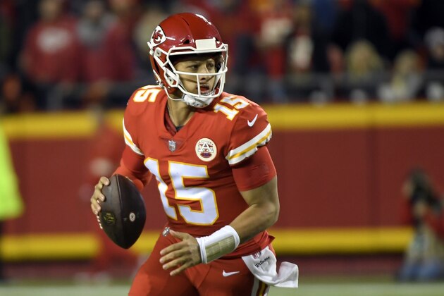 Kansas City Chiefs quarterback Patrick Mahomes (15) scrambles with the ball during the first half of an NFL football game against the Cincinnati Bengals in Kansas City, Mo., Sunday, Oct. 21, 2018. (AP Photo/Reed Hoffmann)