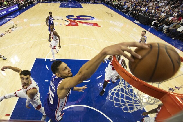 Philadelphia 76ers Ben Simmons, right of Australia, goes up for the shot with Chicago Bulls Zach LaVine, left, defending during the first half of an NBA basketball game, Thursday, Oct. 18, 2018, in Philadelphia. The 76ers won 127-108. (AP Photo/Chris Szagola)