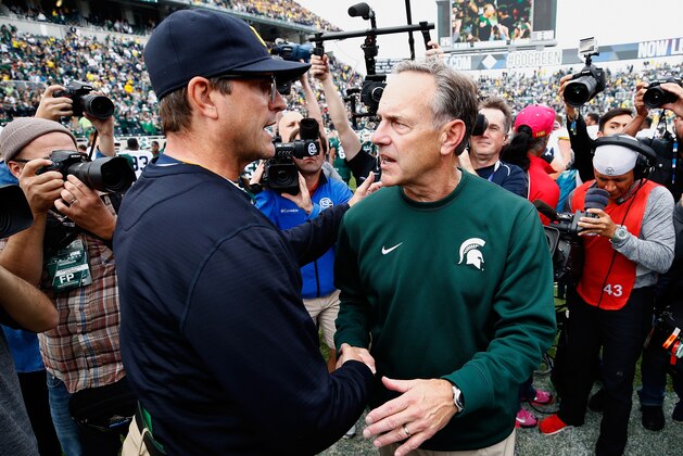 EAST LANSING, MI - OCTOBER 29: Head coach Jim Harbaugh Michigan Wolverines shakes hands with head coach Mark Dantonio of the Michigan State Spartans after a 32-23 Michigan win at Spartan Stadium on October 29, 2016 in East Lansing, Michigan. (Photo by Gregory Shamus/Getty Images)
