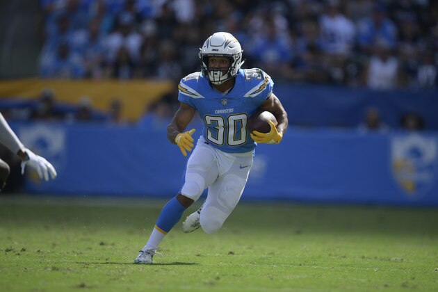 Los Angeles Chargers running back Austin Ekeler runs for a touchdown during the first half of an NFL football game against the Oakland Raiders Sunday, Oct. 7, 2018, in Carson, Calif. (AP Photo/Mark J. Terrill)