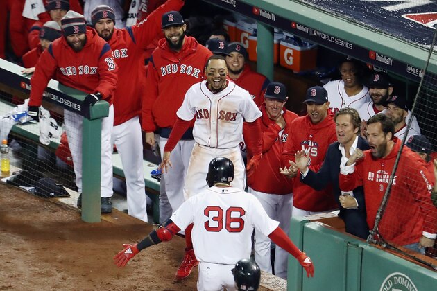 BOSTON, MA - OCTOBER 23:  Eduardo Nunez #36 of the Boston Red Sox is congratulated by his teammate Mookie Betts #50 after his three-run home run during the seventh inning against the Los Angeles Dodgers in Game One of the 2018 World Series at Fenway Park on October 23, 2018 in Boston, Massachusetts.  (Photo by Al Bello/Getty Images)