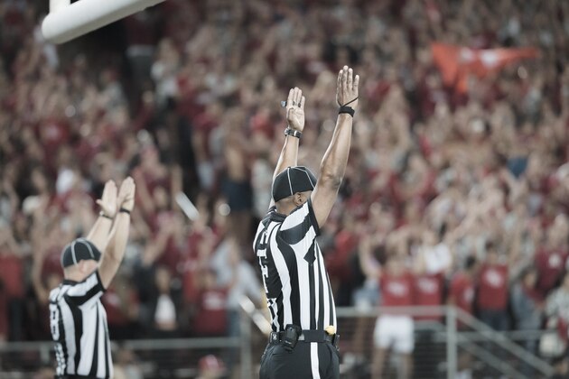 PALO ALTO, CA - SEPTEMBER 23:  Field Judge Michael Hall (right) and Back Judge Steve Hudson (left) signal a score during an NCAA Pac-12 football game between the UCLA Bruins and the Stanford Cardinal on September 23, 2017 at Stanford Stadium in Palo Alto, California.  (Photo by David Madison/Getty Images)