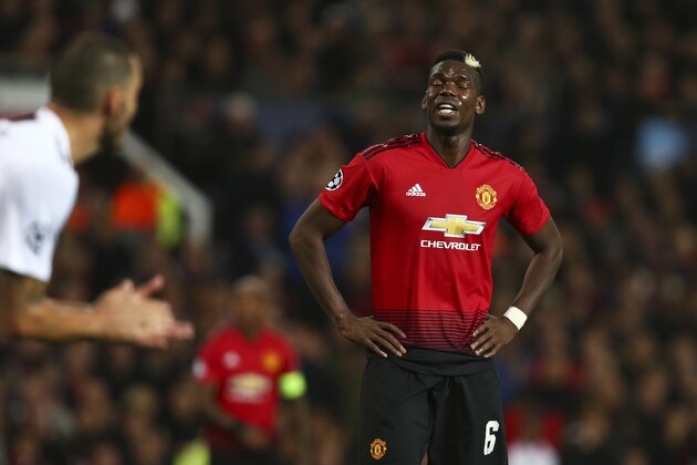 ManU midfielder Paul Pogba reacts after missing a chance to score during the Champions League group H soccer match between Manchester United and Juventus at Old Trafford, Manchester, England, Tuesday, Oct. 23, 2018. (AP Photo/Dave Thompson)