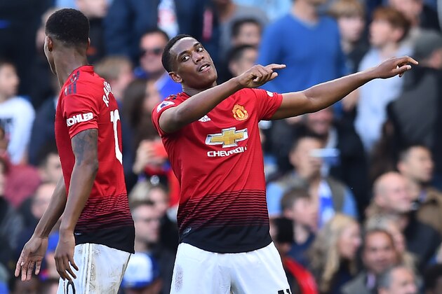 Manchester United's French striker Anthony Martial (R) celebrates with Manchester United's English striker Marcus Rashford (L) after scoring their second goal during the English Premier League football match between Chelsea and Manchester United at Stamford Bridge in London on October 20, 2018. (Photo by Glyn KIRK / AFP) / RESTRICTED TO EDITORIAL USE. No use with unauthorized audio, video, data, fixture lists, club/league logos or 'live' services. Online in-match use limited to 120 images. An additional 40 images may be used in extra time. No video emulation. Social media in-match use limited to 120 images. An additional 40 images may be used in extra time. No use in betting publications, games or single club/league/player publications. /         (Photo credit should read GLYN KIRK/AFP/Getty Images)