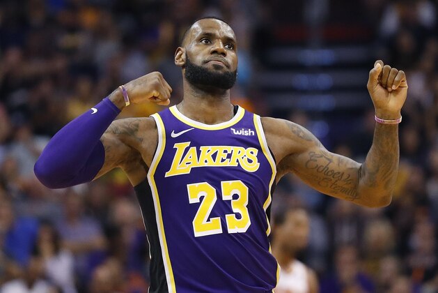 Los Angeles Lakers forward LeBron James (23) celebrates a basket against the Phoenix Suns during the second half of an NBA basketball game, Wednesday, Oct. 24, 2018, in Phoenix. (AP Photo/Matt York)