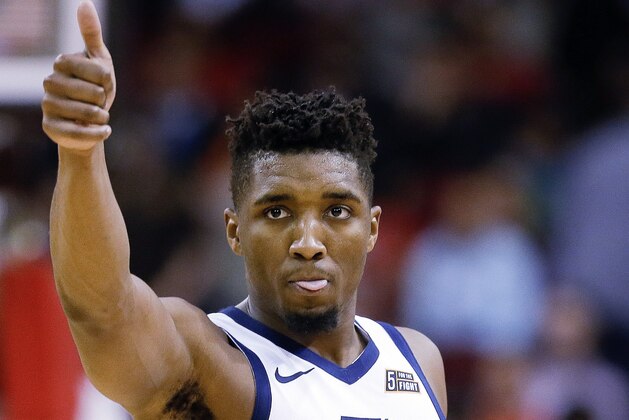 Utah Jazz guard Donovan Mitchell gives a thumbs-up near the end of the second half of an NBA basketball game against the Houston Rockets, Wednesday, Oct. 24, 2018, In Houston. Utah won 100-89. (AP Photo/Eric Christian Smith)