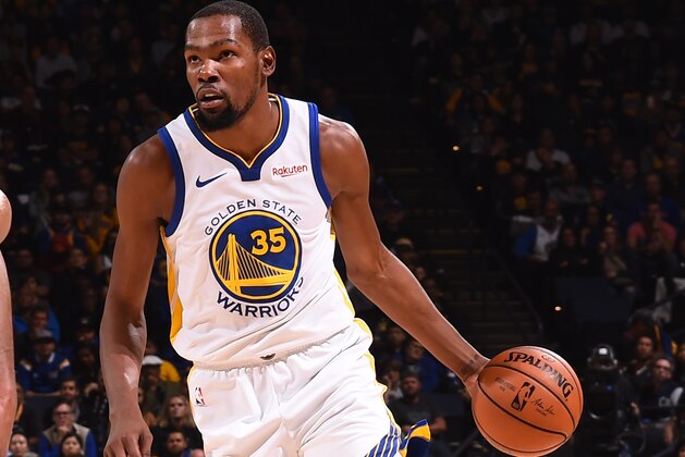 OAKLAND, CA - OCTOBER 22: Kevin Durant #35 of the Golden State Warriors handles the ball against the Phoenix Suns during a game on October 22, 2018 at Oracle Arena in Oakland, California. NOTE TO USER: User expressly acknowledges and agrees that, by downloading and or using this photograph, User is consenting to the terms and conditions of the Getty Images License Agreement. Mandatory Copyright Notice: Copyright 2018 NBAE (Photo by Noah Graham/NBAE via Getty Images)
