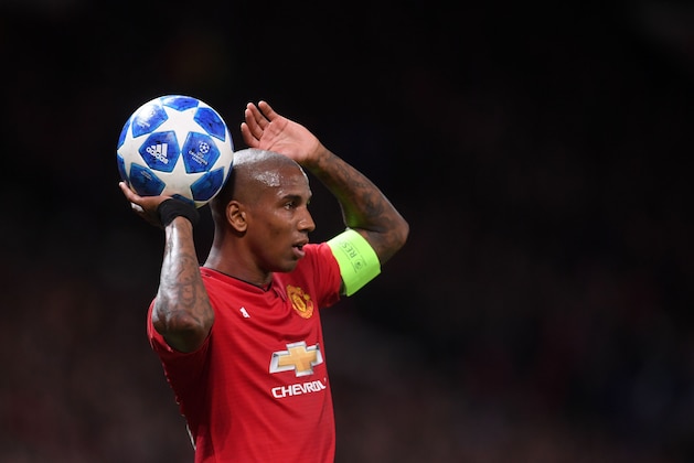 MANCHESTER, ENGLAND - OCTOBER 23: Ashley Young of Manchester United prepares to take a throw-in during the Group H match of the UEFA Champions League between Manchester United and Juventus at Old Trafford on October 23, 2018 in Manchester, United Kingdom. (Photo by Laurence Griffiths/Getty Images)
