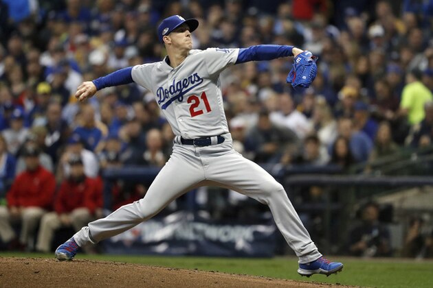 Los Angeles Dodgers starting pitcher Walker Buehler (21) throws during the first inning of Game 7 of the National League Championship Series baseball game against the Milwaukee Brewers Saturday, Oct. 20, 2018, in Milwaukee. (AP Photo/Jeff Roberson)