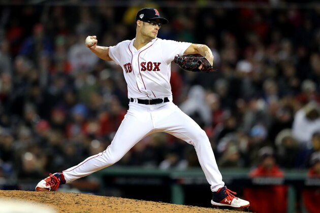 BOSTON, MA - OCTOBER 23:  Joe Kelly #56 of the Boston Red Sox delivers the pitch during the sixth inning against the Los Angeles Dodgers in Game One of the 2018 World Series at Fenway Park on October 23, 2018 in Boston, Massachusetts.  (Photo by Elsa/Getty Images)