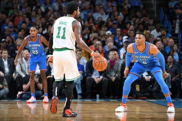 OKLAHOMA CITY, OK - OCTOBER 25: Kyrie Irving #11 of the Boston Celtics handles the ball against Russell Westbrook #0 of the Oklahoma City Thunder on October 25, 2018 at Chesapeake Energy Arena in Oklahoma City, Oklahoma. NOTE TO USER: User expressly acknowledges and agrees that, by downloading and/or using this photograph, user is consenting to the terms and conditions of the Getty Images License Agreement. Mandatory Copyright Notice: Copyright 2018 NBAE (Photo by Garrett Ellwood/NBAE via Getty Images)