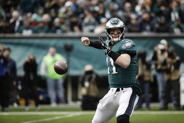 Philadelphia Eagles quarterback Carson Wentz (11) in action during an NFL football game against the Carolina Panthers in Philadelphia, Sunday, Oct. 21, 2018. (AP Photo/Matt Rourke)