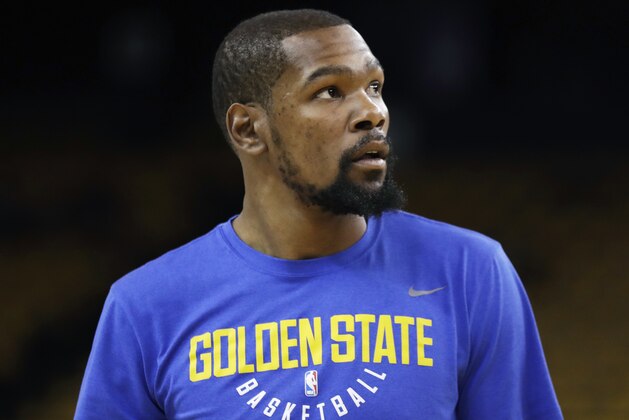 Golden State Warriors forward Kevin Durant warms up before Game 2 of basketball's NBA Finals between the Warriors and the Cleveland Cavaliers in Oakland, Calif., Sunday, June 3, 2018. (AP Photo/Marcio Jose Sanchez)