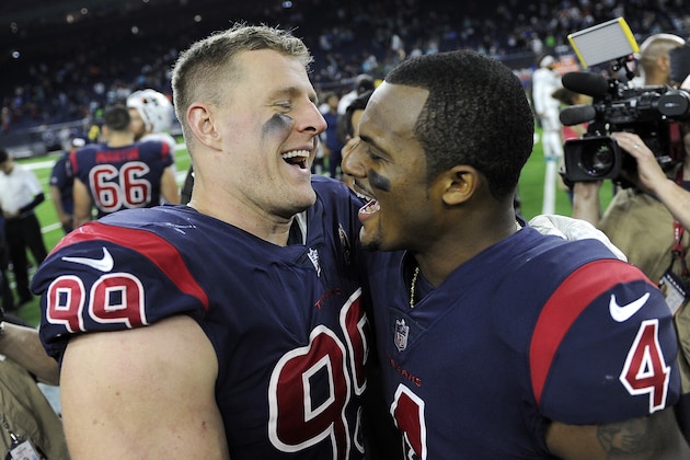 Houston Texans defensive end J.J. Watt (99) and quarterback Deshaun Watson (4) celebrate their win over Miami Dolphins in an NFL football game, Thursday, Oct. 25, 2018, in Houston. (AP Photo/Eric Christian Smith)