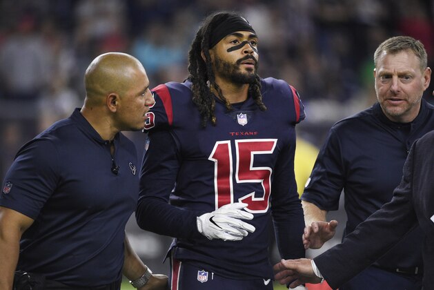 Houston Texans wide receiver Will Fuller (15) is helped off of the field during the second half of an NFL football game against the Miami Dolphins, Thursday, Oct. 25, 2018, in Houston. (AP Photo/Eric Christian Smith)