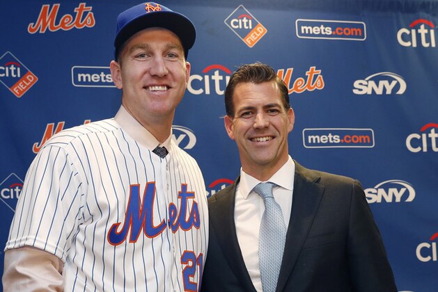 CORRECTS SPELLING OF LAST NAME TO WAGENEN, NOT WAGNEN - New York Mets newly-signed third baseman Todd Frazier, left, poses for photographers with his agent, Brodie Van Wagenen, after the former New York Yankees third baseman signed with the Mets, Wednesday, Feb. 7, 2018, in New York. Frazier reportedly signed a two-year deal, finalized on Wednesday. The contract calls for Frazier to be paid $8 million this year and $9 million in 2019. (AP Photo/Kathy Willens)