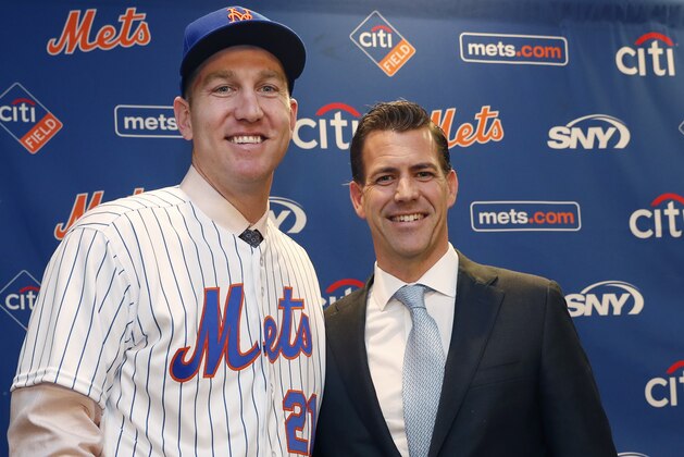 CORRECTS SPELLING OF LAST NAME TO WAGENEN, NOT WAGNEN - New York Mets newly-signed third baseman Todd Frazier, left, poses for photographers with his agent, Brodie Van Wagenen, after the former New York Yankees third baseman signed with the Mets, Wednesday, Feb. 7, 2018, in New York. Frazier reportedly signed a two-year deal, finalized on Wednesday. The contract calls for Frazier to be paid $8 million this year and $9 million in 2019. (AP Photo/Kathy Willens)