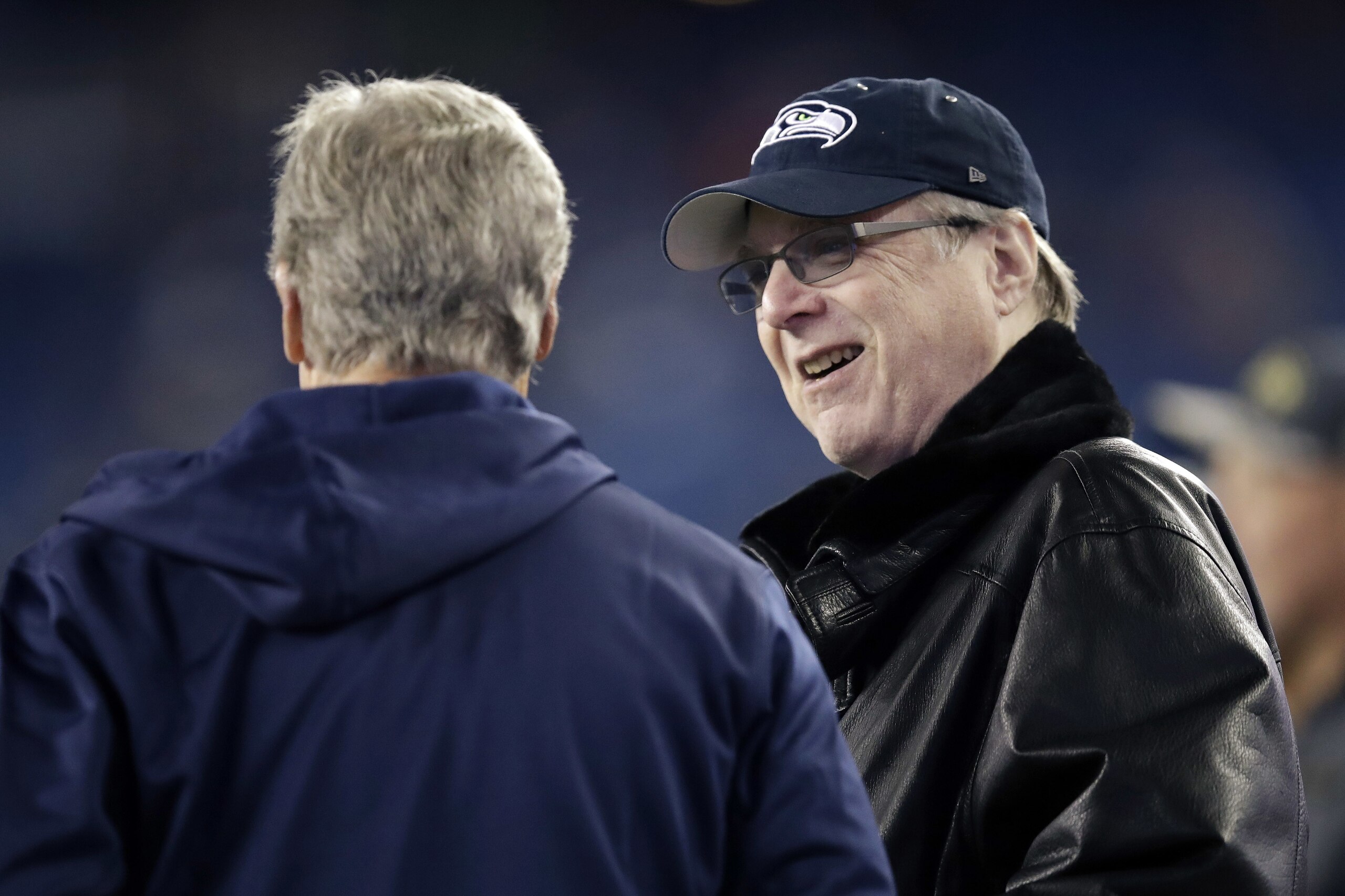 Seattle Seahawks head coach Pete Carroll, left, speaks to team owner Paul Allen before an NFL football game against the New England Patriots, Sunday, Nov. 13, 2016, in Foxborough, Mass. (AP Photo/Charles Krupa)