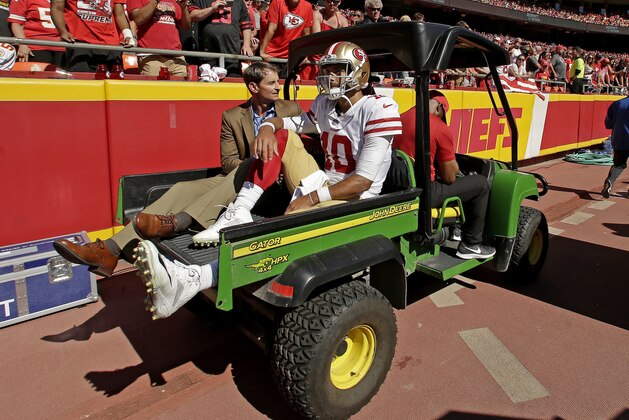 FILE - In this Sunday, Sept. 23, 2018, file photo, San Francisco 49ers quarterback Jimmy Garoppolo (10) is carted off the field after being injured in the second half of an NFL football game against the Kansas City Chiefs in Kansas City, Mo. Coach Kyle Shanahan said Garoppolo had an operation to repair a torn anterior cruciate ligament on Wednesday, Oct. 3, 2018. Shanahan said he didn't know whether any additional damage needed to be repaired or know whether Garoppolo would be recovered in time for the offseason program next spring.  (AP Photo/Charlie Riedel, File)
