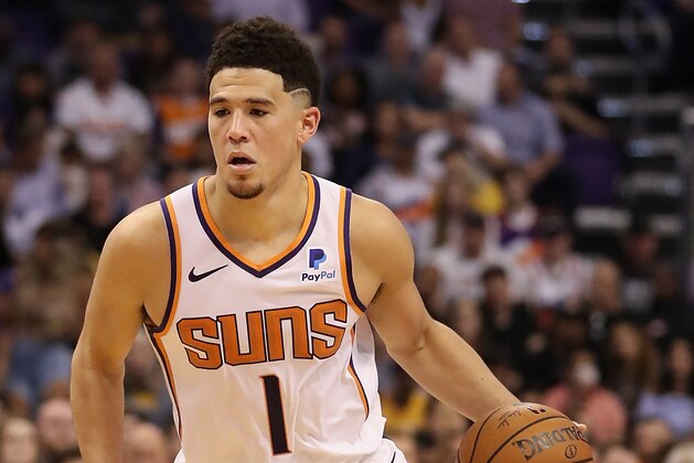 PHOENIX, AZ - OCTOBER 24:  Devin Booker #1 of the Phoenix Suns handles the ball during the NBA game against the Los Angeles Lakers at Talking Stick Resort Arena on October 24, 2018 in Phoenix, Arizona.  The Lakers defeated the Suns 131-113.   NOTE TO USER: User expressly acknowledges and agrees that, by downloading and or using this photograph, User is consenting to the terms and conditions of the Getty Images License Agreement.  (Photo by Christian Petersen/Getty Images)