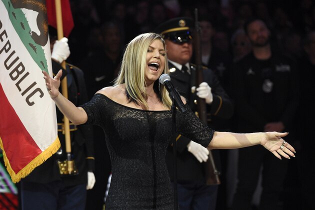 In this Sunday, Feb. 18, 2018, photo, Fergie performs the national anthem before the start of the NBA All-Star basketball game in Los Angeles. (AP Photo/Chris Pizzello)