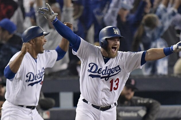 Los Angeles Dodgers' Max Muncy celebrates his walk off home run against the Boston Red Sox during the 18th inning in Game 3 of the World Series baseball game on Saturday, Oct. 27, 2018, in Los Angeles. (AP Photo/Mark J. Terrill)