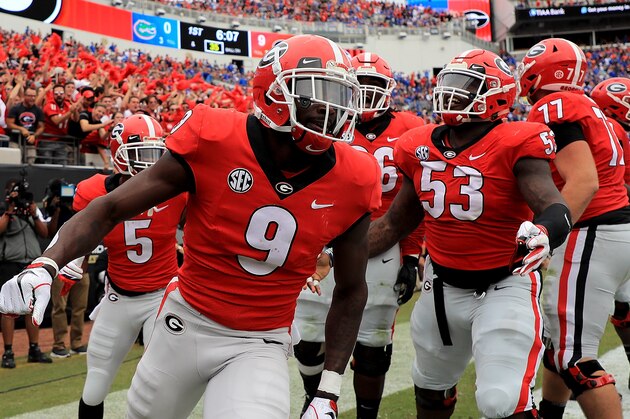 JACKSONVILLE, FL - OCTOBER 27:  Jeremiah Holloman #9 of the Georgia Bulldogs celebrates a touchdown during a game against the Florida Gators at TIAA Bank Field on October 27, 2018 in Jacksonville, Florida.  (Photo by Mike Ehrmann/Getty Images)