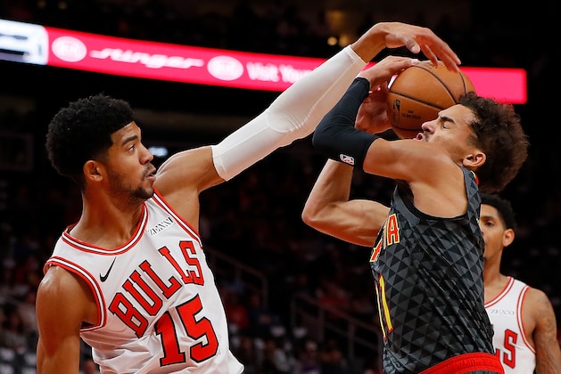 ATLANTA, GA - OCTOBER 27:  Chandler Hutchison #15 of the Chicago Bulls defends against Trae Young #11 of the Atlanta Hawks at State Farm Arena on October 27, 2018 in Atlanta, Georgia.  NOTE TO USER: User expressly acknowledges and agrees that, by downloading and or using this photograph, User is consenting to the terms and conditions of the Getty Images License Agreement.  (Photo by Kevin C. Cox/Getty Images)