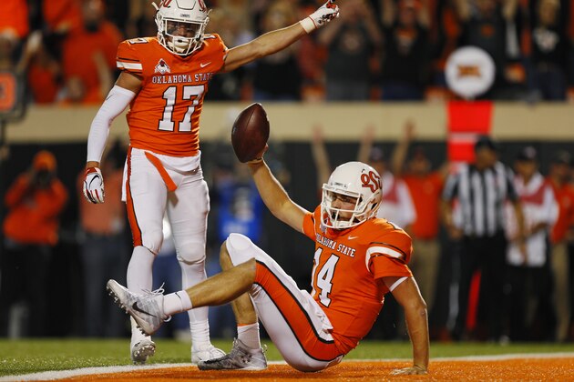 STILLWATER, OK - OCTOBER 27: Quarterback Taylor Cornelius #14 of the Oklahoma State Cowboys falls backward into the end zone on a seven yard run but falls just short of scoring a touchdown on October 27, 2018 at Boone Pickens Stadium in Stillwater, Oklahoma. Cornelius scored on the next play and the Cowboys lead 31-14 at the half. (Photo by Brian Bahr/Getty Images) STILLWATER, OK - OCTOBER 27: Quarterback Taylor Cornelius #14 of the Oklahoma State Cowboys falls backward into the end zone on a seven yard run but falls just short of scoring a touchdown on October 27, 2018 at Boone Pickens Stadium in Stillwater, Oklahoma. Cornelius scored on the next play and the Cowboys lead 31-14 at the half. (Photo by Brian Bahr/Getty Images)