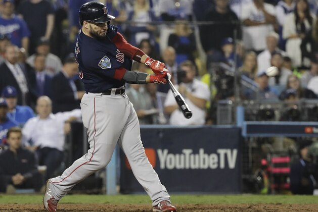 Boston Red Sox's Steve Pearce hits a three-run RBI double during the ninth inning in Game 4 of the World Series baseball game against the Los Angeles Dodgers on Saturday, Oct. 27, 2018, in Los Angeles. (AP Photo/David J. Phillip)