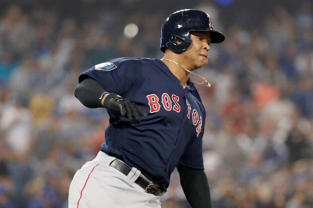 LOS ANGELES, CA - OCTOBER 27: Rafael Devers #11 of the Boston Red Sox runs to first base on his rbi single to center field in the ninth inning of Game Four of the 2018 World Series against the Los Angeles Dodgers at Dodger Stadium on October 27, 2018 in Los Angeles, California.  (Photo by Sean M. Haffey/Getty Images)