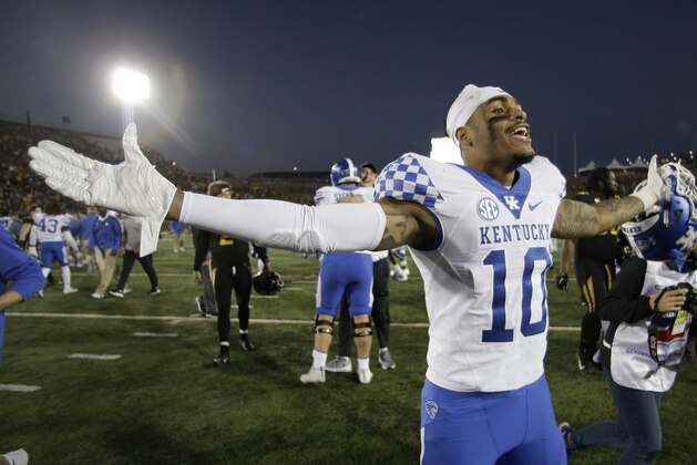 Kentucky running back Asim Rose (10) celebrates as he walks off the field after Kentucky won an NCAA college football game against Missouri on a touchdown with no time left on the clock Saturday, Oct. 27, 2018, in Columbia, Mo. Kentucky won 15-14. (AP Photo/Charlie Riedel)