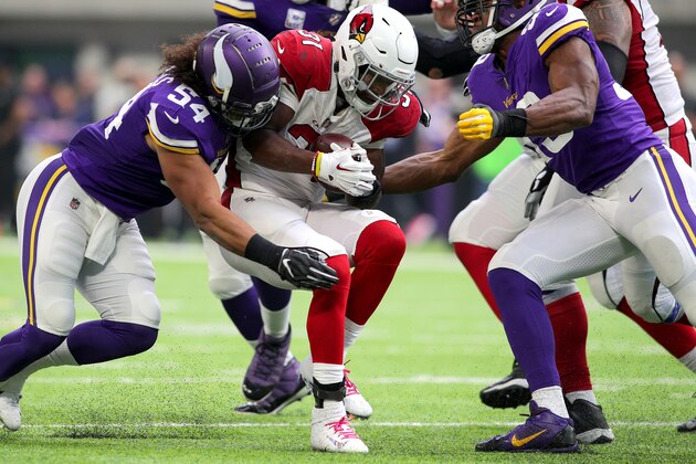 MINNEAPOLIS, MN - OCTOBER 14: David Johnson #31 of the Arizona Cardinals is tackled with the ball by Minnesota Vikings defenders in the third quarter of the game at U.S. Bank Stadium on October 14, 2018 in Minneapolis, Minnesota. (Photo by Adam Bettcher/Getty Images)