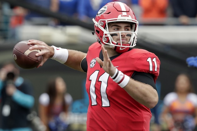 Georgia quarterback Jake Fromm (11) throws a pass against Florida during the first half of an NCAA college football game Saturday, Oct. 27, 2018, in Jacksonville, Fla. (AP Photo/John Raoux)
