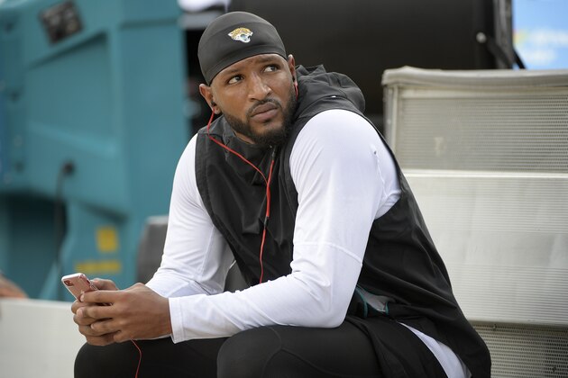Jacksonville Jaguars defensive back Barry Church relaxes on the bench before an NFL football game against the New England Patriots Sunday, Sept. 16, 2018, in Jacksonville, Fla. (AP Photo/Phelan M. Ebenhack)