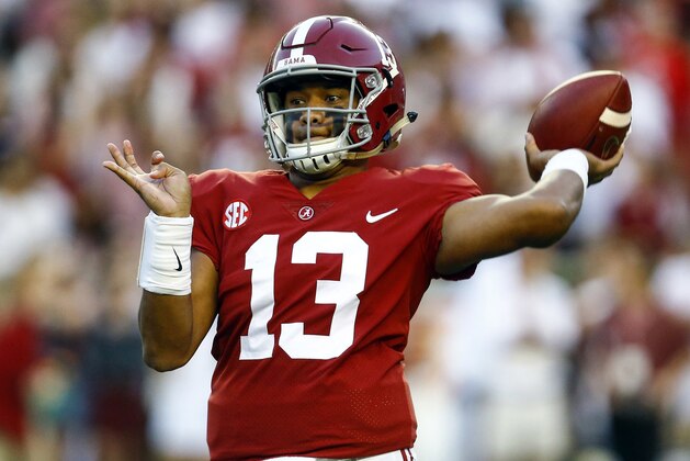 FILE - In this Saturday, Oct. 13, 2018, file photo, Alabama quarterback Tua Tagovailoa (13) throws a pass during the first half of the team's NCAA college football game against Missouri in Tuscaloosa, Ala. Alabama quarterback and Heisman Trophy front-runner Tua Tagovailoa aggravated a sprained right knee last week. The top-ranked Crimson Tide face Tennessee on Saturday. (AP Photo/Butch Dill, File)