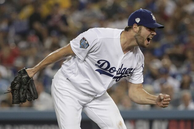 Los Angeles Dodgers starting pitcher Rich Hill celebrates after the last out in the top of the sixth inning against the Boston Red Sox in Game 4 of the World Series baseball game on Saturday, Oct. 27, 2018, in Los Angeles. (AP Photo/Jae C. Hong)