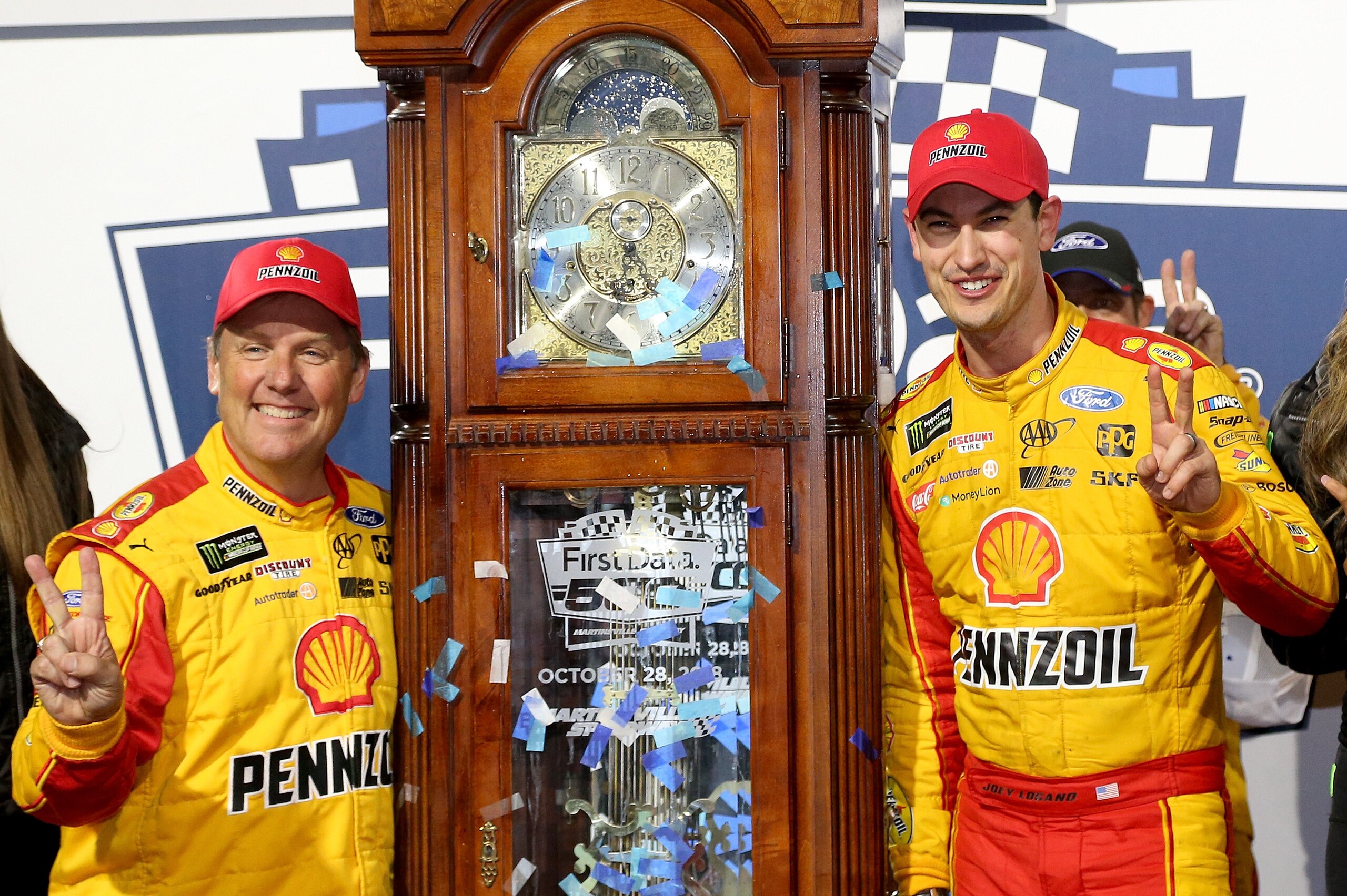 MARTINSVILLE, VA - OCTOBER 28:  Joey Logano, driver of the #22 Shell Pennzoil Ford, and his crew chief Todd Gordon celebrate in Victory Lane after winning the Monster Energy NASCAR Cup Series First Data 500 at Martinsville Speedway on October 28, 2018 in Martinsville, Virginia.  (Photo by Brian Lawdermilk/Getty Images)