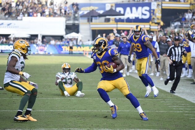 Los Angeles Rams running back Todd Gurley turns away from the end zone before being tackled by Green Bay Packers cornerback Tramon Williams, left, during the second half of an NFL football game, Sunday, Oct. 28, 2018, in Los Angeles. (AP Photo/Denis Poroy)