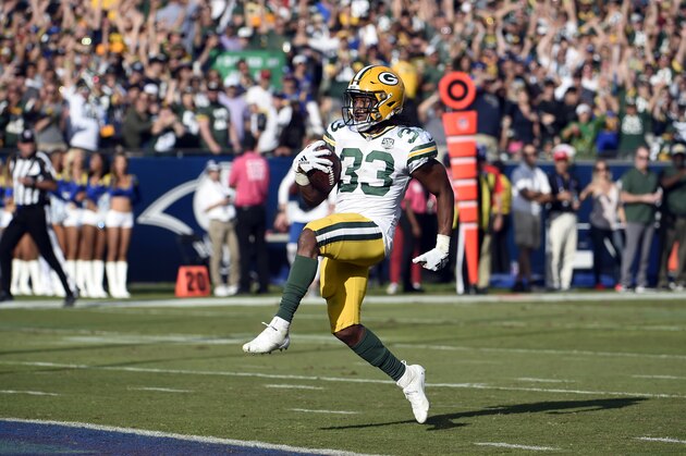 Green Bay Packers running back Aaron Jones scores a touchdown during the second half of an NFL football game against the Los Angeles Rams, Sunday, Oct. 28, 2018, in Los Angeles. (AP Photo/Denis Poroy)
