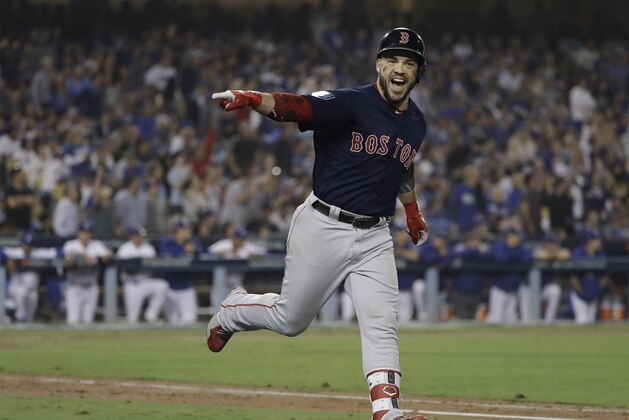Boston Red Sox's Steve Pearce celebrates his second home run during the eighth inning in Game 5 of the World Series baseball game against the Los Angeles Dodgers on Sunday, Oct. 28, 2018, in Los Angeles. (AP Photo/David J. Phillip)