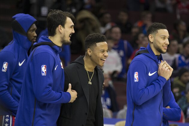 PHILADELPHIA, PA - JANUARY 5: Dario Saric #9, Markelle Fultz #20, Joel Embiid #21, and Ben Simmons #25 of the Philadelphia 76ers react from the bench against the Detroit Pistons in the fourth quarter at the Wells Fargo Center on January 5, 2018 in Philadelphia, Pennsylvania. The 76ers defeated the Pistons 114-78. NOTE TO USER: User expressly acknowledges and agrees that, by downloading and or using this photograph, User is consenting to the terms and conditions of the Getty Images License Agreement. (Photo by Mitchell Leff/Getty Images)