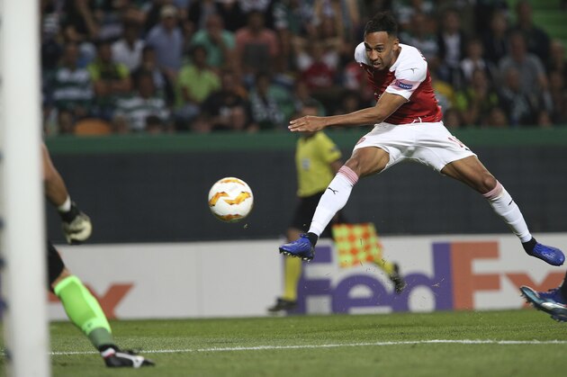 Arsenal's Pierre-Emerick Aubameyang shoots on goal during the Europa League group E soccer match between Sporting CP and Arsenal at the Alvalade stadium in Lisbon, Thursday, Oct. 25, 2018. (AP Photo/Armando Franca)